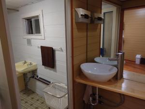 a bathroom with a sink and a mirror at 泉崎荘 in Naha +83 photos