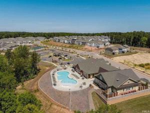 an aerial view of a swimming park in a residential neighborhood at The Villas Antilia in Durham