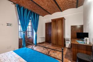 Postel nebo postele na pokoji v ubytování Agriturismo Meriggio