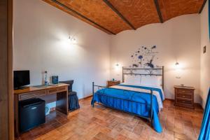 Postel nebo postele na pokoji v ubytování Agriturismo Meriggio