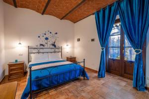 Postel nebo postele na pokoji v ubytování Agriturismo Meriggio