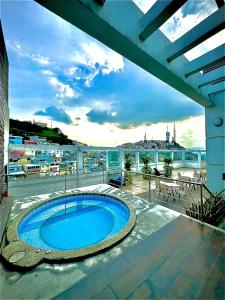 a swimming pool on the balcony of a building at River view 6-04 in Guayaquil