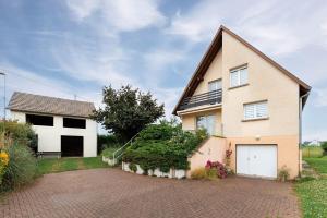 a large house with a driveway in front of it at Charly's House - Parking et terrasse in Houssen