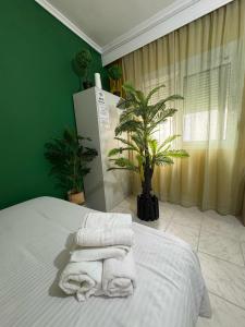 Postel nebo postele na pokoji v ubytování Tropical studio - myHomee
