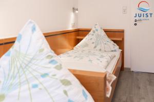 Postel nebo postele na pokoji v ubytování Haus Sylke 137 - Ferienwohnung 7