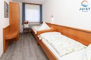Postel nebo postele na pokoji v ubytování Haus Sylke 137 - Ferienwohnung 7