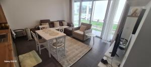 a small living room with a table and chairs at Villa Buki in Lezhë