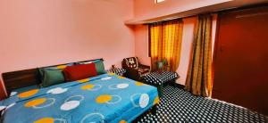 Postel nebo postele na pokoji v ubytování Sangam View Home stay
