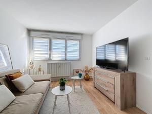 Μια τηλεόραση ή/και κέντρο ψυχαγωγίας στο Appartement Cosy Florange