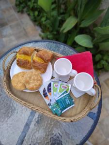 a plate of bread and cookies on a table at Alojamiento El Centenario in San Martín