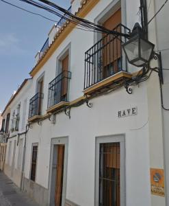 a white building with a sign that says hay bc at Casa Rave 17 in Córdoba
