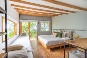 Voodi või voodid majutusasutuse Hotel La Palma y El Tucán - Café y Naturaleza toas