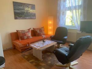 Posezení v ubytování 1 Zimmer Wohnung in Trebbin mit PKW Stellplatz + 1 fotografie