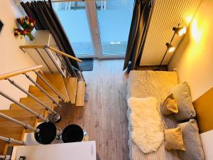 an overhead view of a living room with stairs at Feldhouse in Bremen