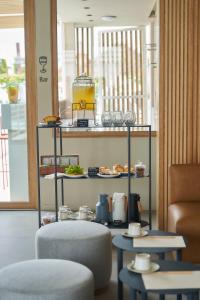 a shelf with some food and drinks on it at Bromelia Hotel Boutique in Buenos Aires