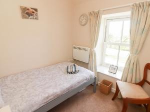 Ένα ή περισσότερα κρεβάτια σε δωμάτιο στο Daffodil Apartment
