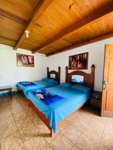 Postel nebo postele na pokoji v ubytování Hotel y Rest. las Cristalinas