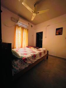 Postel nebo postele na pokoji v ubytování Orchid Home Stay