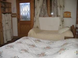 Postel nebo postele na pokoji v ubytování L'ore Du Bois - Maison D'hôtes