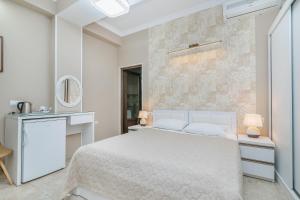 Postel nebo postele na pokoji v ubytování Nicolas Boutique Hotel