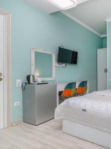 Postel nebo postele na pokoji v ubytování Nicolas Boutique Hotel