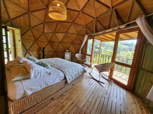 Postel nebo postele na pokoji v ubytování Tambo Eco Hotel