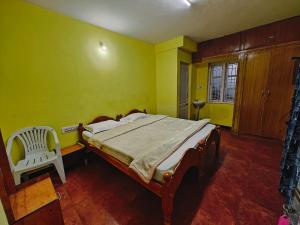 Postel nebo postele na pokoji v ubytování Lakshmi cottage
