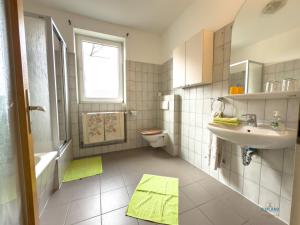 a small bathroom with a sink and a toilet at Landhaus Stolper Wohnung 3 in Herzberg am Harz