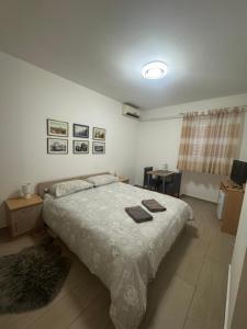 Postel nebo postele na pokoji v ubytování Miriam Rooms Zadar