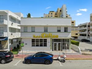 a blue car parked in front of a hotel station at The Clifton Hotel in Miami Beach