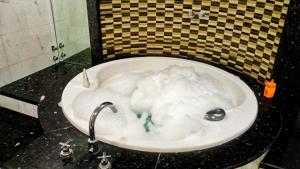 a bath tub filled with snow in a bathroom at Oceanda Appart N1 Agadir in Agadir