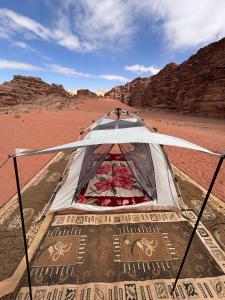 a tent in the middle of the desert at Wadi Rum Paris Cave in Wadi Rum +17 photos