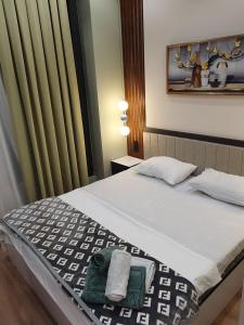 En eller flere senge i et værelse på Комфорт и Уют + 15 billeder