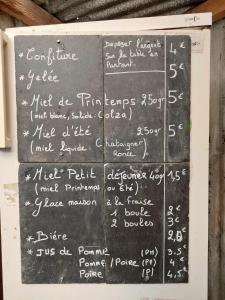 a chalkboard with numbers and calculations on it at La yourte au cœur de la Normandie in Boudeville