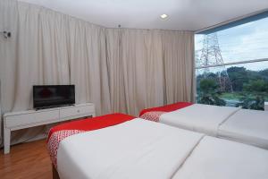 Postel nebo postele na pokoji v ubytování New Bangi Gateway Hotel
