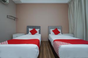 Postel nebo postele na pokoji v ubytování New Bangi Gateway Hotel