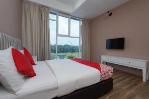 Postel nebo postele na pokoji v ubytování New Bangi Gateway Hotel