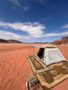 a tent in the middle of the desert at Wadi Rum Paris Cave in Wadi Rum