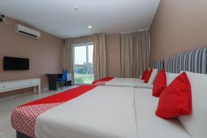 Postel nebo postele na pokoji v ubytování New Bangi Gateway Hotel