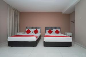 Postel nebo postele na pokoji v ubytování New Bangi Gateway Hotel