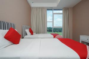 Postel nebo postele na pokoji v ubytování New Bangi Gateway Hotel