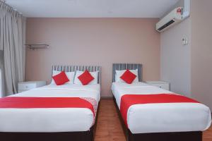 Postel nebo postele na pokoji v ubytování New Bangi Gateway Hotel