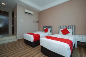 Postel nebo postele na pokoji v ubytování New Bangi Gateway Hotel