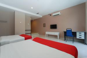 Postel nebo postele na pokoji v ubytování New Bangi Gateway Hotel