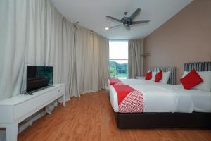 Postel nebo postele na pokoji v ubytování New Bangi Gateway Hotel