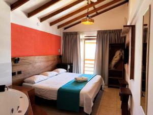 a hotel room with a bed and a sink at Hotel Route 66 in Vichayito