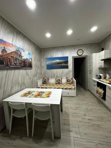 a room with a table and a bed in it at Mary House Apartments in Catania