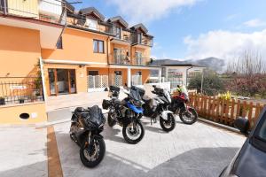 a group of motorcycles parked in front of a building at Casa Emma in Agerola