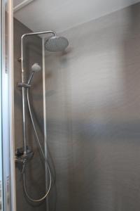 a shower with a shower head in a bathroom at Blueportel in Le Portel +81 photos