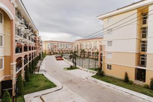 an empty street in a city with buildings at AR09 HBRentals 1BR Smart Unit in Davao City